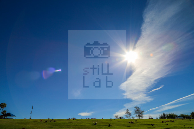 Cemetary with blue sky and sun