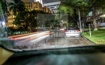 View from street parked car at night